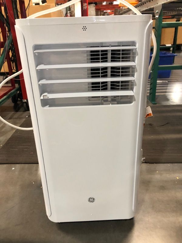 Photo 1 of **READ NOTES, MINOR DAMAGE**
GE Portable 3-in-1 Air Conditioner with Dehumidifier and Fan, 9,000 BTU, Cooling for 250 sq ft rooms, Includes Remote, Vent Hose and Easy Window Install Kit