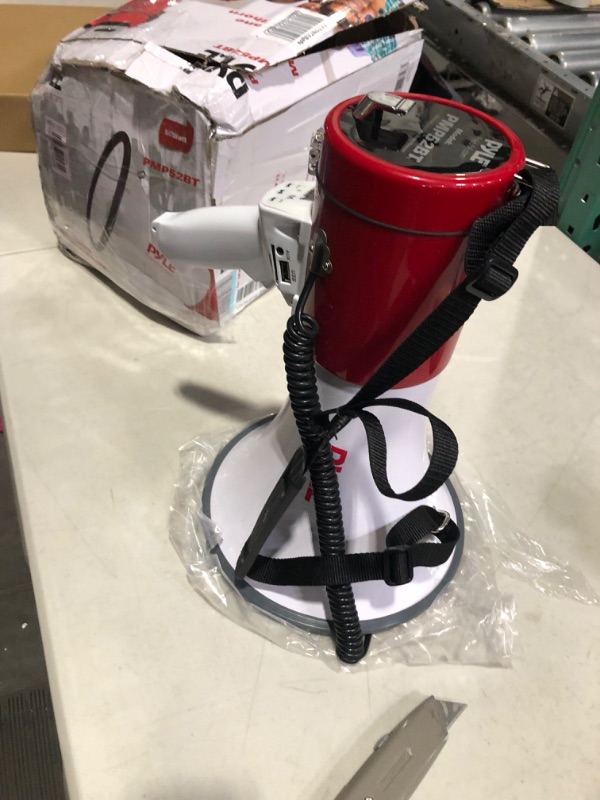 Photo 3 of ***PARTS ONLY****
Portable Megaphone Speaker PA Bullhorn - Built-in Siren, 50W Adjustable Volume Control & 1200 Yard Range - Ideal for Any Outdoor Sports, Cheerleading Fans & Coaches or for Safety Drills - Pyle PMP52BT