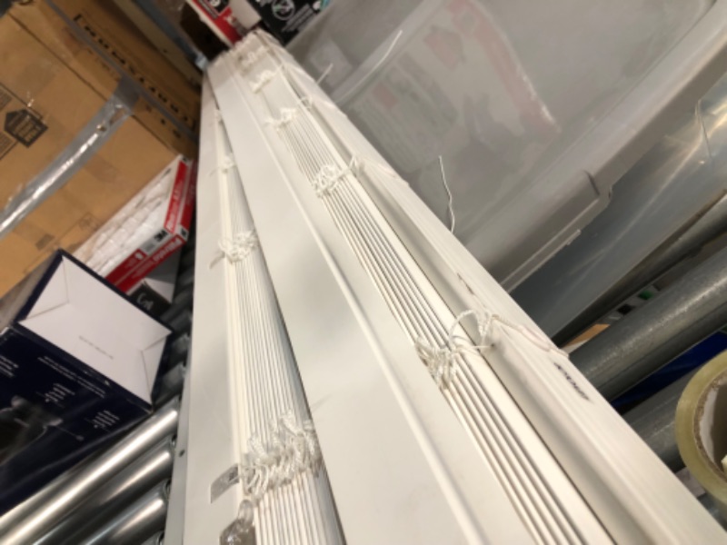 Photo 2 of ***DAMAGED - HAS BEEN CUT - IS SHORTER THAN ADVERTISED - HARDWARE MISSING - NO PACKAGING***
LEVOLOR Trim+Go 2.5-in Slat Width 72-in x 64-in Cordless White Faux Wood Room Darkening Horizontal Blinds
