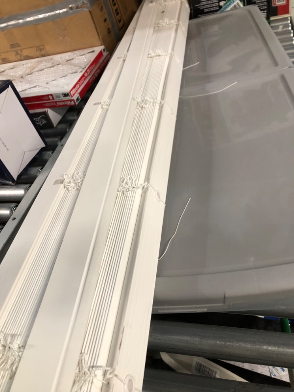 Photo 3 of ***DAMAGED - HAS BEEN CUT - IS SHORTER THAN ADVERTISED - HARDWARE MISSING - NO PACKAGING***
LEVOLOR Trim+Go 2.5-in Slat Width 72-in x 64-in Cordless White Faux Wood Room Darkening Horizontal Blinds
