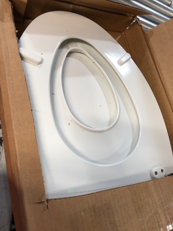 Photo 2 of **SEE NOTES/DAMAGED**
MAYFAIR 1888SLOW 000 NextStep2 Toilet Seat with Built-In Potty-Training Seat, Slow-Close, Removable that will Never Loosen, ELONGATED, White White Elongated Toilet Seat