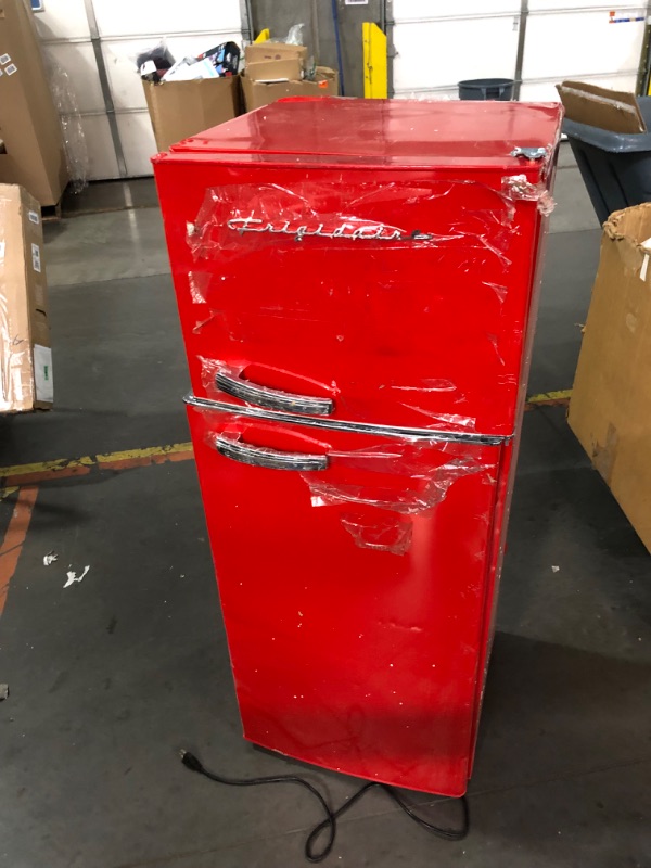 Photo 1 of ***NONREFUNDABLE - MAJOR DAMAGE - THIS SALE FINAL - SEE COMMENTS***
Frigidaire EFR753-Red, 2 Door Apartment Size Refrigerator with Freezer, 7.5 cu ft, Retro, Red