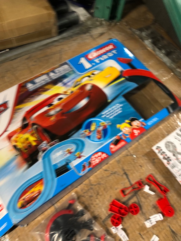 Photo 6 of *FOR PARTS ONLY* READ NOTES
Carrera First Disney/Pixar Cars - Slot Car Race Track - Includes 2 Cars: Lightning McQueen and Dinoco Cruz - Battery-Powered Beginner Racing Set for Kids Ages 3 Years and Up Disney Cars w/ Spinners