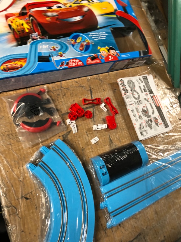 Photo 2 of *FOR PARTS ONLY* READ NOTES
Carrera First Disney/Pixar Cars - Slot Car Race Track - Includes 2 Cars: Lightning McQueen and Dinoco Cruz - Battery-Powered Beginner Racing Set for Kids Ages 3 Years and Up Disney Cars w/ Spinners