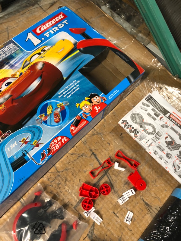 Photo 4 of *FOR PARTS ONLY* READ NOTES
Carrera First Disney/Pixar Cars - Slot Car Race Track - Includes 2 Cars: Lightning McQueen and Dinoco Cruz - Battery-Powered Beginner Racing Set for Kids Ages 3 Years and Up Disney Cars w/ Spinners