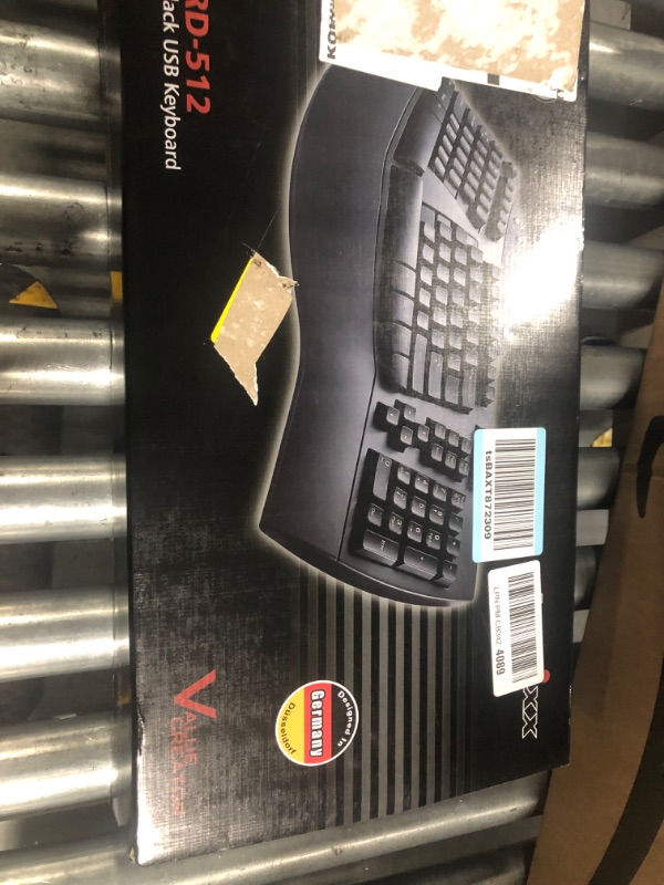 Photo 1 of Perixx Periboard-512 Ergonomic Split Keyboard - Natural Ergonomic Design - Black - Bulky Size 19.09"x9.29"x1.73", US English Layout Wired Black Keyboard