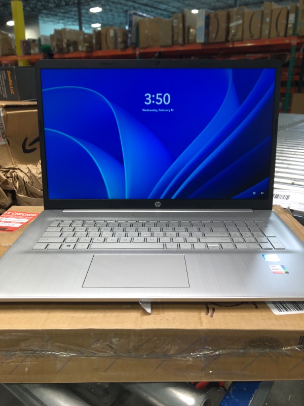 Photo 1 of HP Laptop, 17" HD+ Anti-Glare Screen, 11th Gen Intel Core i5-1135G7, Intel Iris Xe Graphics, Long Battery Life, Webcam, HDMI, Mics, Windows 11 Home, Silver, Microfiber Cloth (32GB RAM | 1TB SSD)
***minor damaged pictured ***
