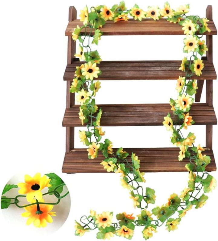 Photo 1 of Beferr Sunflower Garlands Decor-2 Pack 7.5ft/Pcs Artificial Sunflower Vines Silk Hanging Flowers with Green Leaves for Wedding Birthday Party Home Wall Decorations