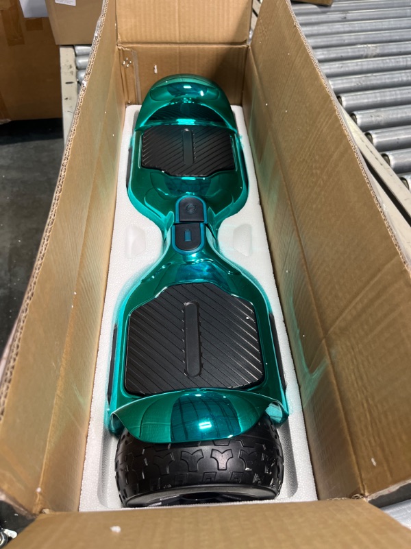 Photo 3 of **USED** 
**FOR PARTS**  Bluetooth Hoverboard, Matt and Chrome Color Hover Board with 6.5" Wheels Built-in Wireless Speaker Bright LED Lights Chrome Turquoise ***CAN BE USED FOR PARTS**** DOESNT WORK**** 