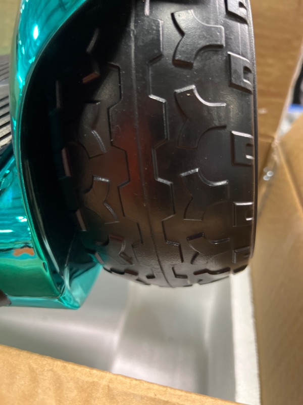Photo 4 of **USED** 
**FOR PARTS**  Bluetooth Hoverboard, Matt and Chrome Color Hover Board with 6.5" Wheels Built-in Wireless Speaker Bright LED Lights Chrome Turquoise ***CAN BE USED FOR PARTS**** DOESNT WORK**** 