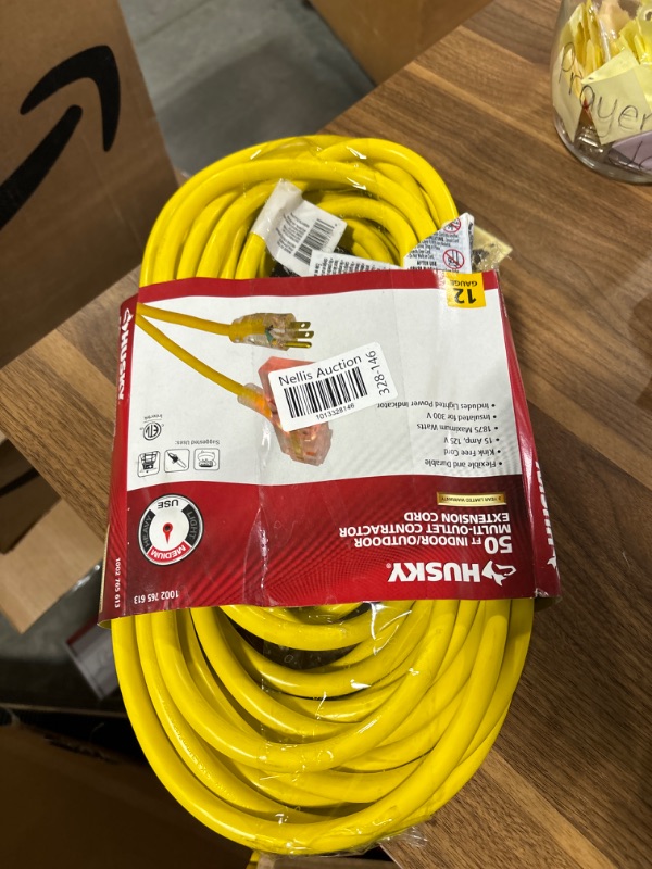 Photo 1 of Husky 50 ft. 12/3 Lighted Triple Tap Extension Cord -8pk