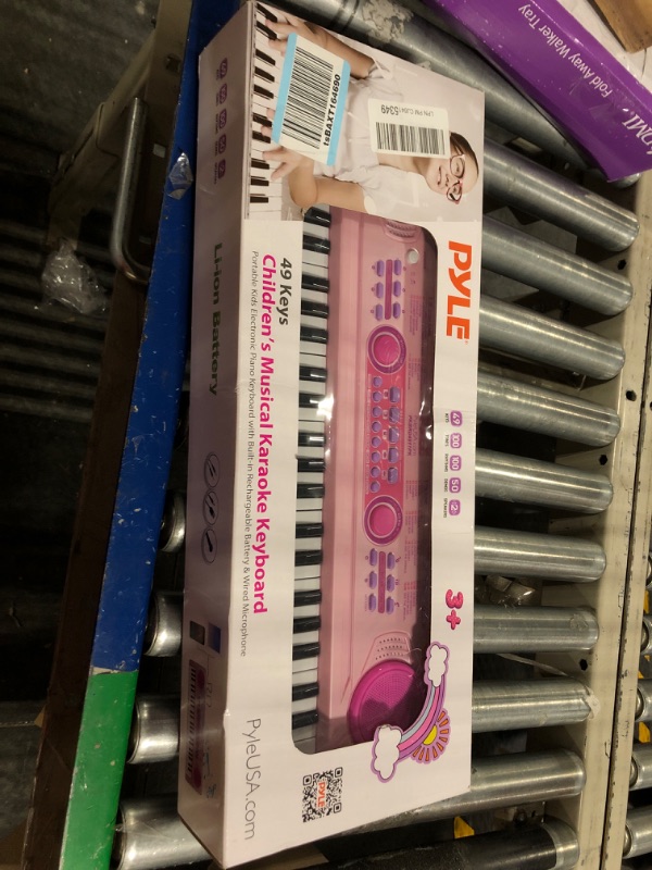 Photo 2 of PYLE-PRO Electric Keyboard Piano for Kids-Portable 49 Key Electronic Musical Karaoke Keyboard, Learning Keyboard for Children w/Drum Pad, Recording, Microphone, Built-in Speaker-PKBRD4911PK (Pink) Pink Keyboard