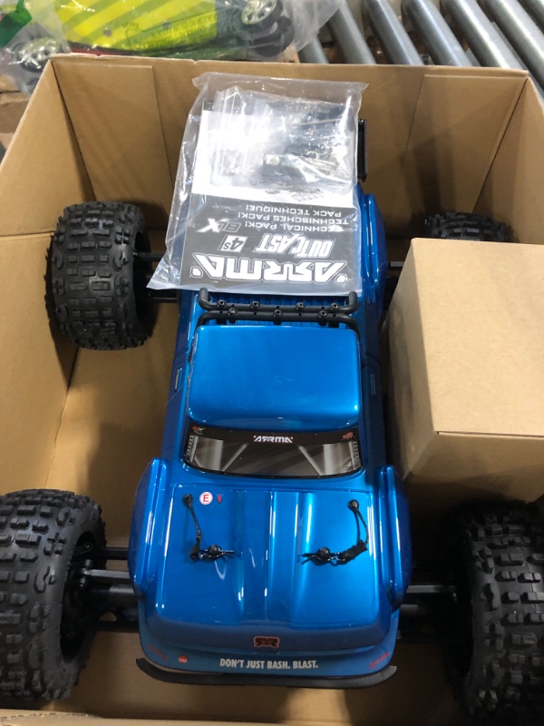 Photo 3 of ARRMA RC Truck 1/10 Outcast 4X4 4S V2 BLX Stunt Truck RTR (Batteries and Charger Not Included) Blue, ARA4410V2T2