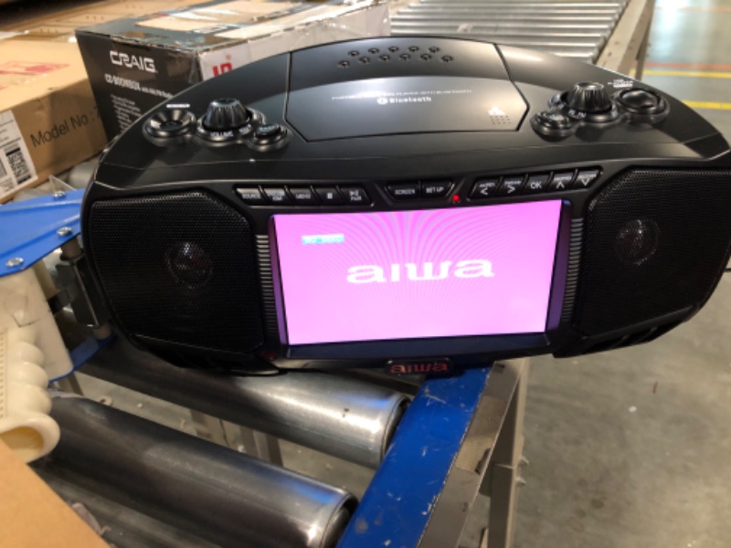 Photo 2 of Aiwa Portable Boombox, Crystal Clear Sound with 3W x 2 Speakers and Bass Function, Featuring a 7" LCD Display, Bluetooth Connectivity, FM Radio, CD/DVD Player, Streaming on Roku and Amazon Firestick Black