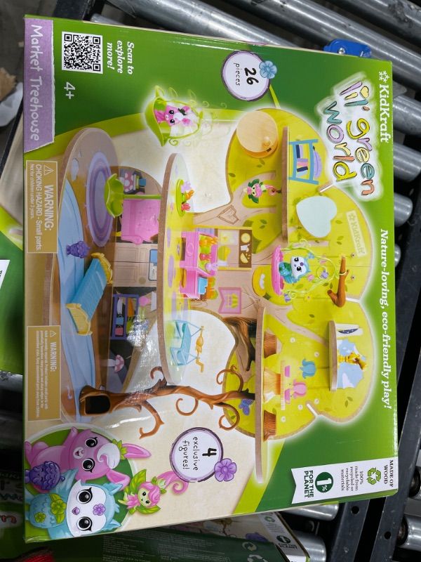 Photo 2 of KidKraft Lil Green World Wooden Market Treehouse Play Set with 26 Accessories
