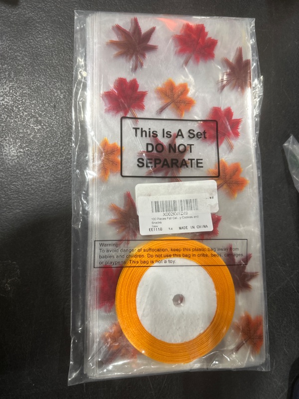 Photo 2 of 100 Pieces Fall Cellophane Bags Thanksgiving Halloween Party Favor Maple Leaf Cello Autumn Treat Bags with A Roll of Orange Ribbon for Chocolate Candy Cookies and Snacks