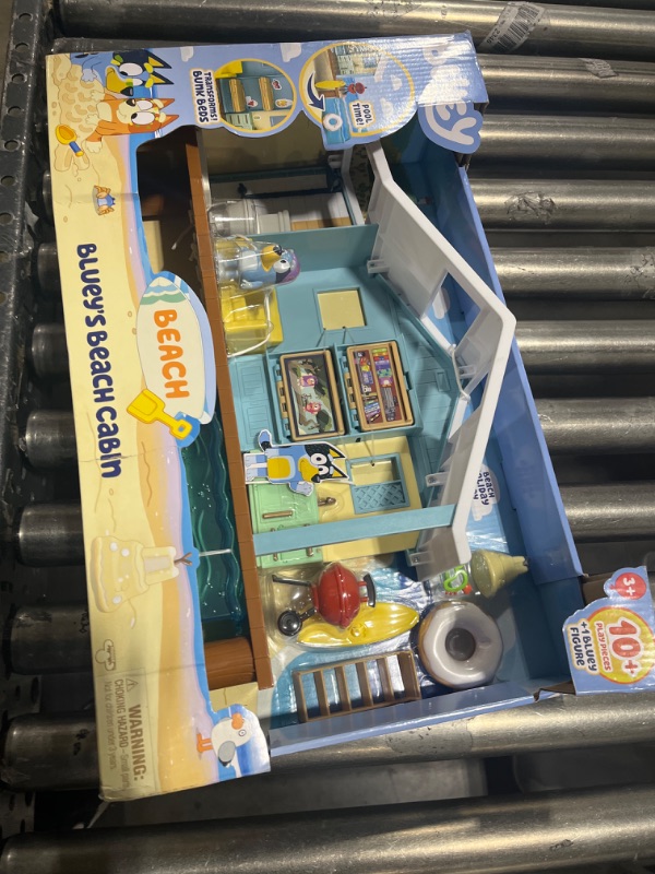 Photo 2 of BLUEY Beach Cabin Playset, with Exclusive Figure with Goggles. Includes 10 Play Pieces and Sticker Sheet