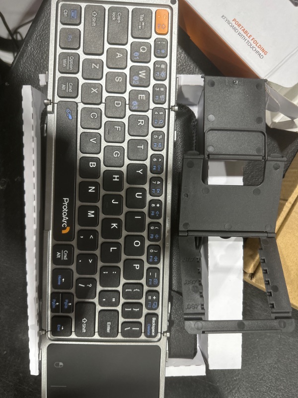 Photo 1 of ProtoArc Foldable Bluetooth Keyboard with Touchpad, XK02 Folding Wireless Keyboard for Travel, Pocket-Sized Compact Portable Keyboard for iPad iPhone Tablet Laptop Windows iOS Android
