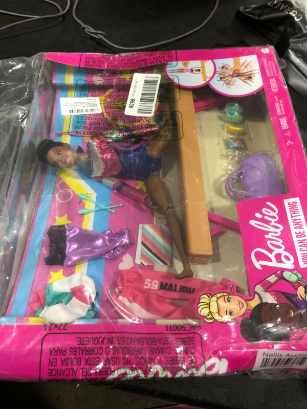 Photo 2 of Barbie Gymnastics Playset with Doll and 15+ Accessories, Twirling Gymnast Toy with Balance Beam, Brunette Doll