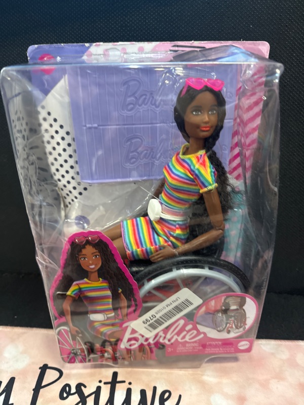 Photo 2 of Barbie Fashionistas Doll #166 with Wheelchair & Crimped Brunette Hair Wearing Rainbow-Striped Dress, White Sneakers, Sunglasses & Fanny Pack, Toy for Kids 3 to 8 Years Old [Amazon Exclusive]