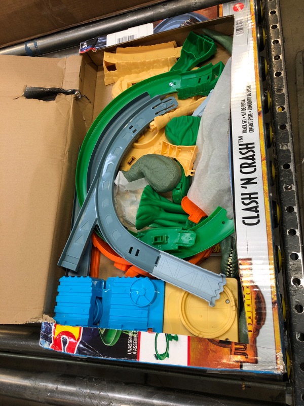 Photo 2 of Hot Wheels Jurassic World Dominion Clash ‘N Crash Track Set with 1 Hot Wheels Car, Motorized Booster with Attacking Dinosaurs, Toy Gift Set for Dino Fans