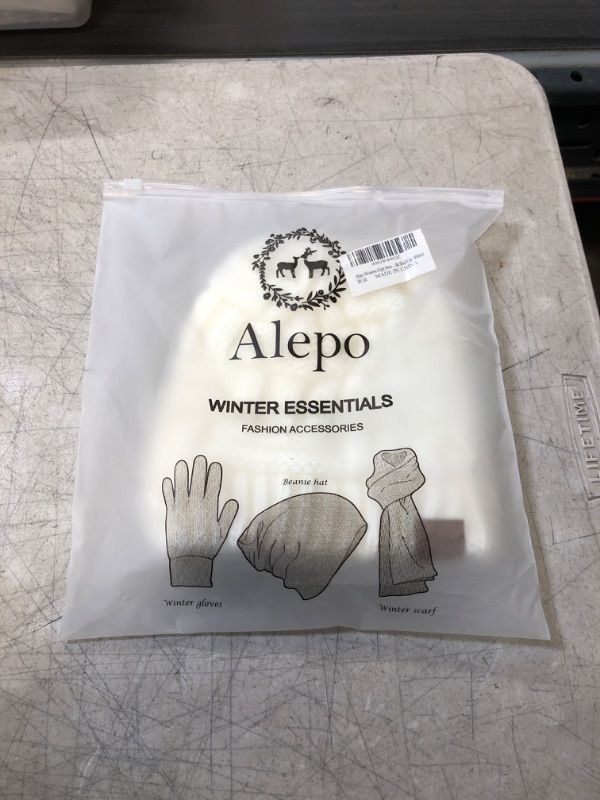 Photo 1 of Alepo Womens High Messy Bun Beanie Hat with Ponytail Hole, Winter Warm Trendy Knit Ski Skull Cap White 1