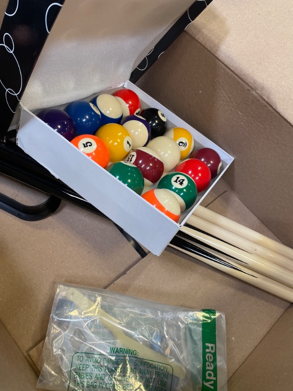 Photo 1 of 3 POOL STICKS AND SET OF POOL BALLS