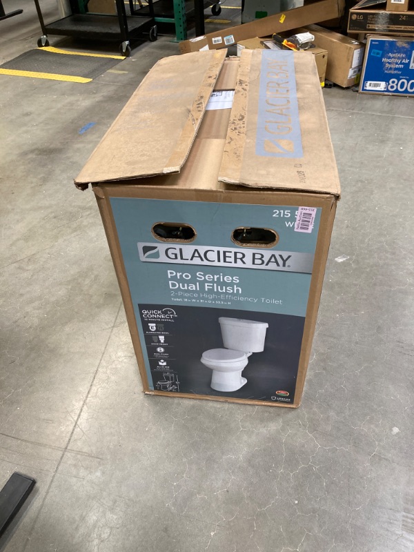 Photo 1 of 2-piece 1.1 GPF/1.6 GPF High Efficiency Dual Flush Complete Elongated Toilet in White, Seat Included