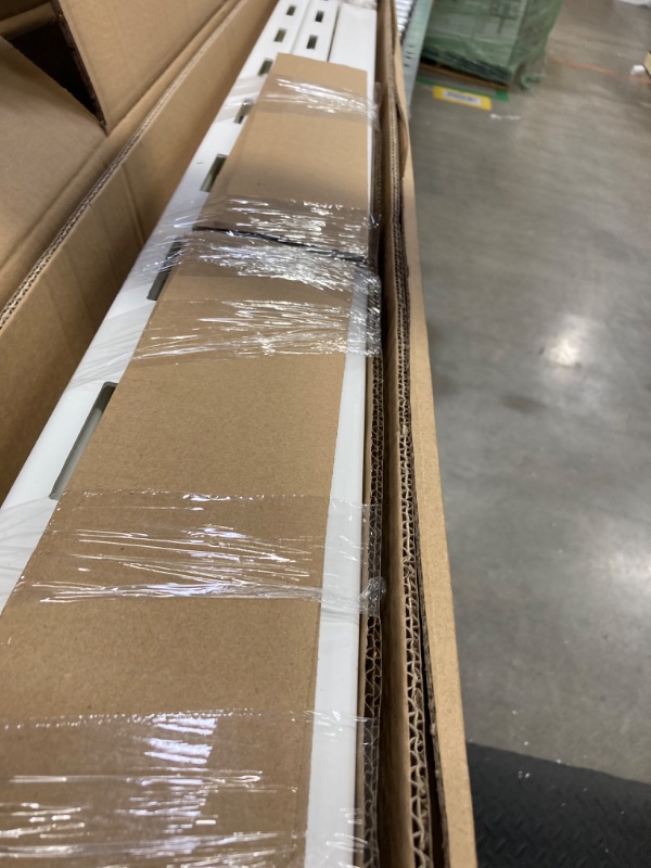 Photo 1 of angled fence panels using v inyl brackets & metal hinge