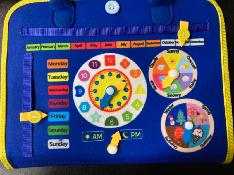 Photo 1 of HONGDDY Busy Board, 12 in 1 Toddler Toys with Peekaboo Books Sensory Toys for Autism Montessori Toys Gifts for 1 2 3 Year Old Boys Girls Learning Fine Motor Skills Travel Toys for Plane Car Giraffe & Clocks - Blue