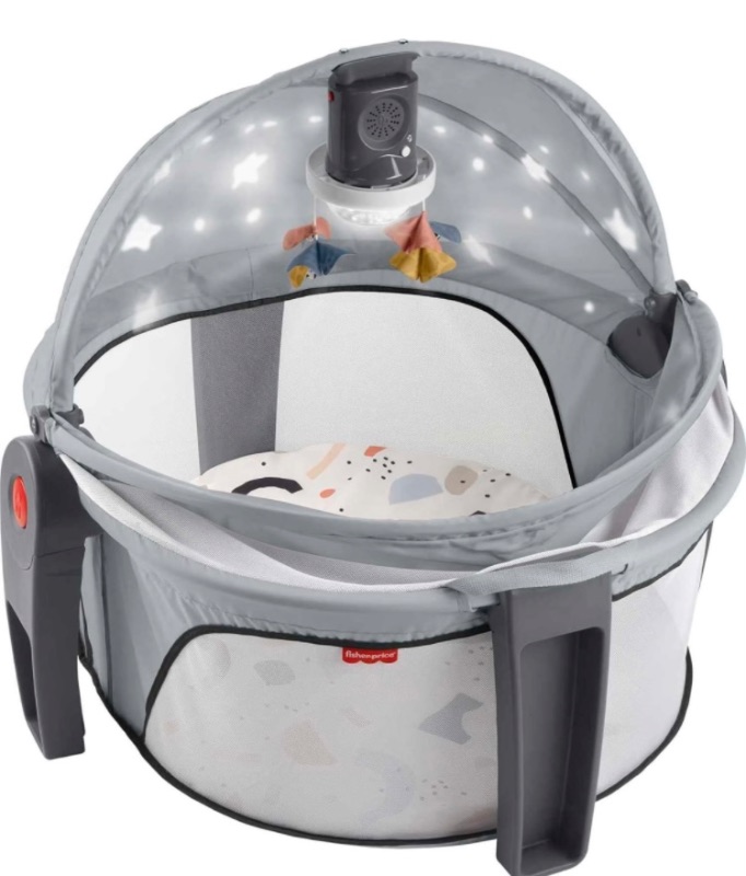 Photo 1 of Fisher-Price Portable Baby Bassinet and Play Space Deluxe On-the-Go Projection Dome with Lights Music and Canopy, Paper Shapes