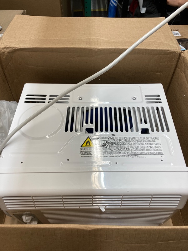Photo 1 of Amazon Basics Window-Mounted Air Conditioner with Mechanical Control - Cools 150 Square Feet, 5000 BTU, AC Unit