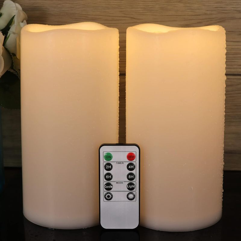 Photo 1 of GenSwin 8” x 4” Waterproof Outdoor Flameless Candles Battery Operated with Remote Timer, Large Flickering LED Pillar Candles for Indoor Outdoor Lanterns, Won’t melt, Long-Lasting(White, Set of 2)