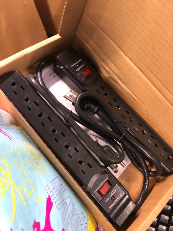 Photo 1 of Amazon Basics 6-Outlet, 200 Joule Surge Protector Power Strip, 2 Foot, Black - Pack of 2 Black Strip