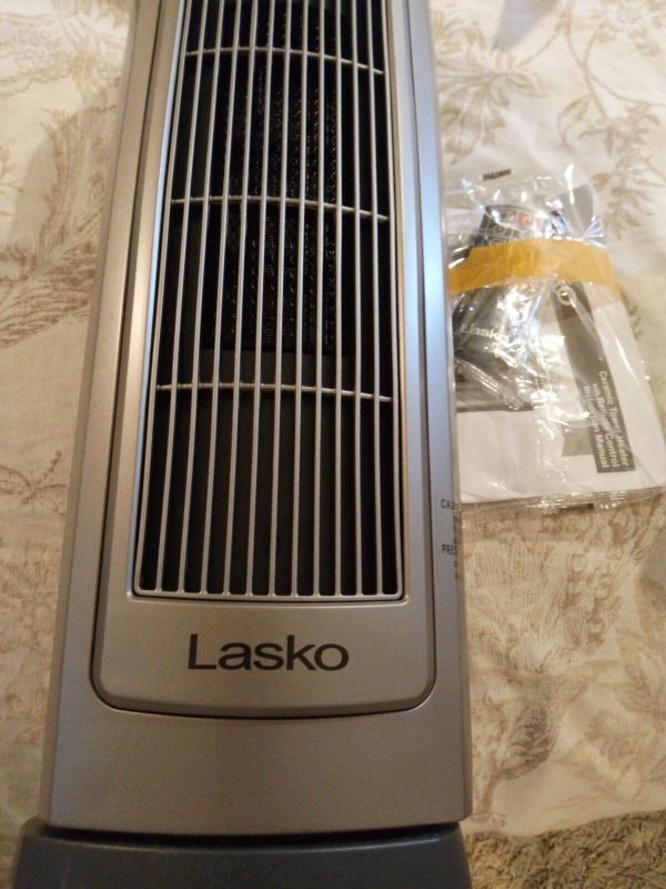 Photo 4 of **USED** Lasko Oscillating Digital Ceramic Tower Heater for Home with Adjustable Thermostat, Timer and Remote Control, 23 Inches, 1500W, Silver, 755320