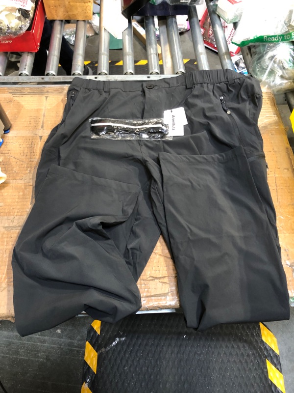 Photo 2 of ** size 3xl*** 
33,000ft Men's Rain Pants, Waterproof Rain Over Pants, Windproof Outdoor Pants for Hiking, Fishing 38W x 30L Black