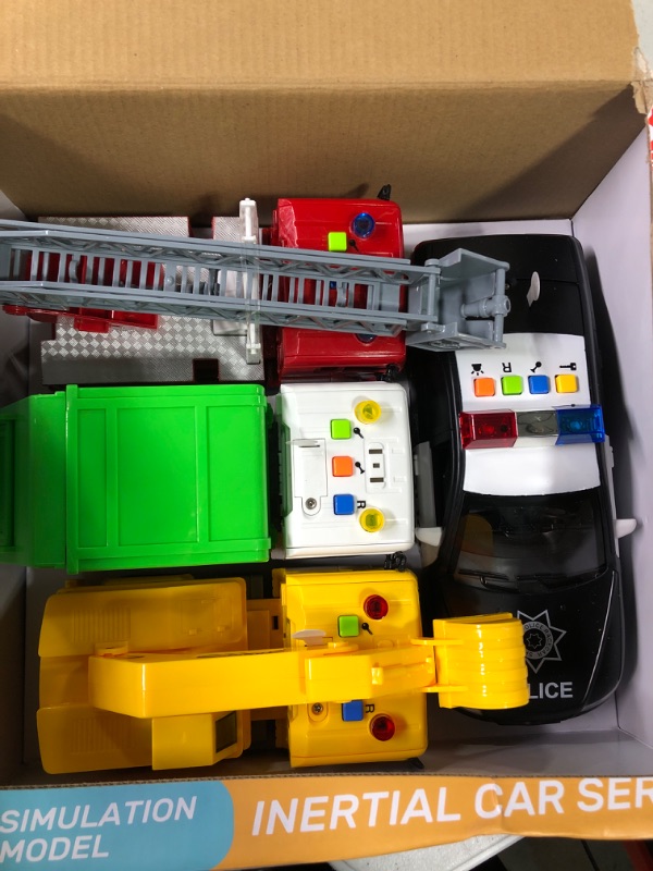 Photo 3 of 4 Pack Fire Truck, Construction Truck, Police Car and Garbage Truck with Sound and Light, Pull Back Cars Push and Go Cars Friction Powered Play Vehicles for Toddler Boys and Girls
