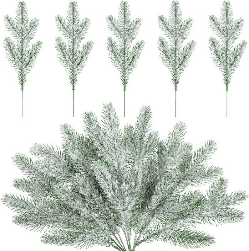 Photo 1 of 30 Pcs Snow Frosted Pine Branches Christmas Artificial Pine Leaves Branches Fake Greenery Plants Pine Sprigs Green Christmas Tree Picks Faux Greenery Stems for DIY Garland Crafts Winter Decorations