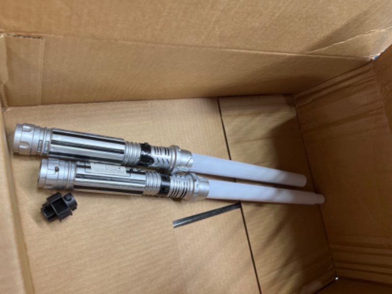 Photo 2 of ***NON FUNCTIONAL//SOLD AS PARTS*** 
JOYIN 2-in-1 Light Up Saber, Sword for Kids, LED Dual Laser Swords Set with FX Sound (Motion Sensitive) and Realistic Sliver Handle for Fighters and Warriors, New Years Eve Party Supplies Kids Stuff Green and Blue