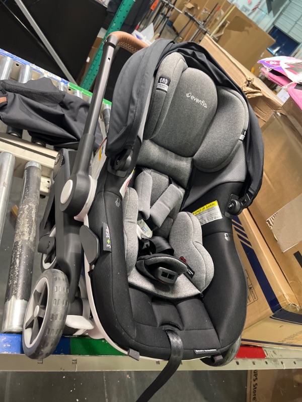 Photo 1 of Evenflo Gold Shyft DualRide Infant Car Seat and Stroller Combo with Carryall Storage (Moonstone Gray)