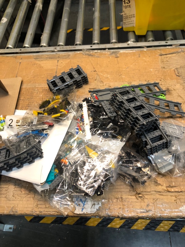 Photo 3 of LEGO City Freight Train Set, 60336 Remote Control Toy for Kids Aged 7 Plus with Sounds, 2 Wagons, Car Transporter, 33 Track Pieces and 2 EV Car Toys ***PARTS MAY BE MISSING***