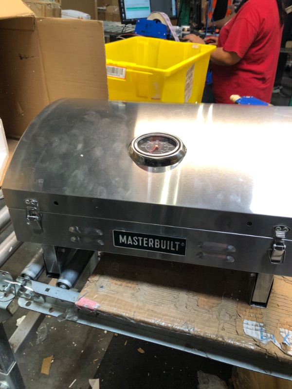 Photo 1 of ****USED**** 
Masterbuilt MB20030819 Portable Propane Grill, Stainless Steel New Version Propane Grill USED