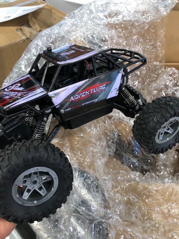 Photo 4 of DEERC DE45 RC Cars Remote Control Car 1:14 Off Road Monster Truck,Metal Shell 4WD Dual Motors LED Headlight Rock Crawler,2.4Ghz All Terrain Hobby Truck with 2 Batteries for 90 Min Play,Boy Adult Gifts