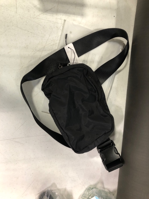 Photo 1 of ODODOS Unisex Mini Belt Bag with Adjustable Strap Small Waist Pouch for Workout Running Travelling Hiking, Black Black Solid