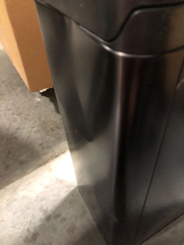 Photo 4 of **DENTED SIDES** 
Kohler 20940-BST Step Trash Can, 13 Gallon, Black with Stainless Steel Black Stainless Steel 13 Gallon Can