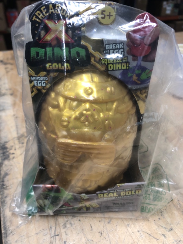 Photo 2 of Treasure X Dino Gold Armored Egg. Break The Egg. Squeeze The Ooze Out. Smash The Fossil to Find The Treasure. Then Build The Dino and Display. Styles May Vary