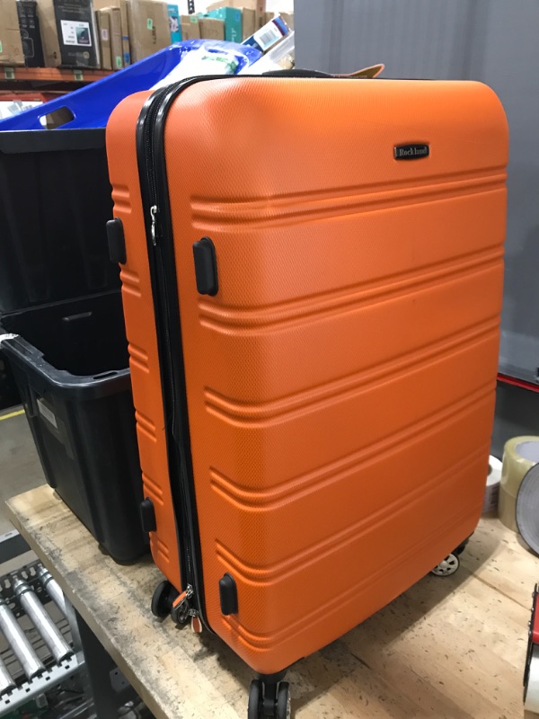 Photo 2 of ***MAJOR DAMAGE - SEE COMMENTS***
Rockland Melbourne Hardside Expandable Spinner Wheel Luggage, Orange, Checked-Large 28-Inch