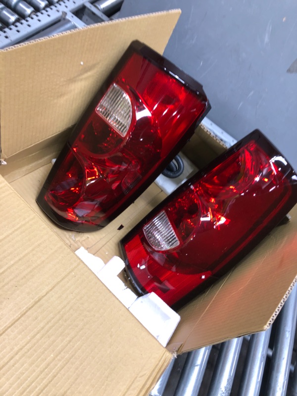 Photo 2 of AmeriLite Replacement with Bulbs and Harness OE Style Ruby Red Incandescent Car Taillights Rear Brake Lamp Set, For 2003-2006 Chevy Silverado, Vehicle Light Assembly, Red/Clear