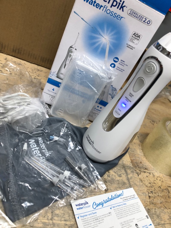 Photo 2 of **APPEARS NEW**
Waterpik Cordless Advanced Water Flosser For Teeth, Gums, Braces, Dental Care With Travel Bag and 4 Tips, ADA Accepted, Rechargeable, Portable, and Waterproof, White WP-580 White Water Flosser