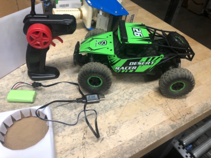 Photo 3 of **POWERS ON MOVES BUT STOPS SUDDENLY , MAY NEED CHARGING**
RACENT Remote Control Car for Boys 20KPH Monster Truck 1:16 All Terrains RC Truck with Headlights and 2 Rechargeable Batteries Gift for Kids Adults Green